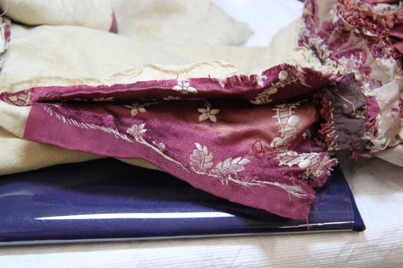 Sleeve seam during treatment. Photo by A. Peranteau, copyright Te Papa.